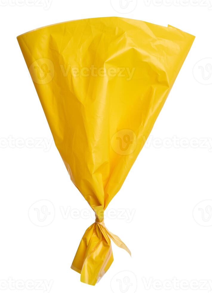 Yellow plastic bag on isolated background photo