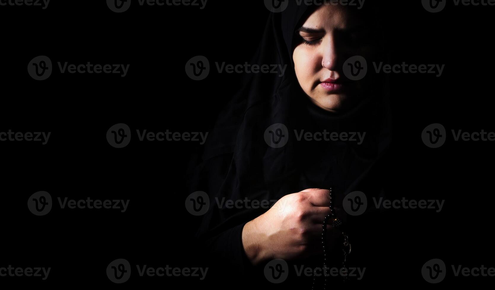 Religious muslim woman in prayer outfit photo