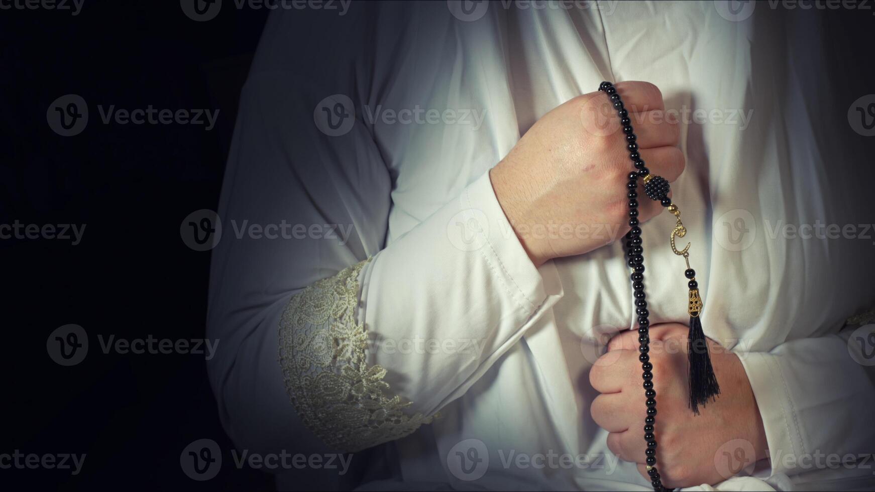 Religious muslim woman in prayer outfit photo