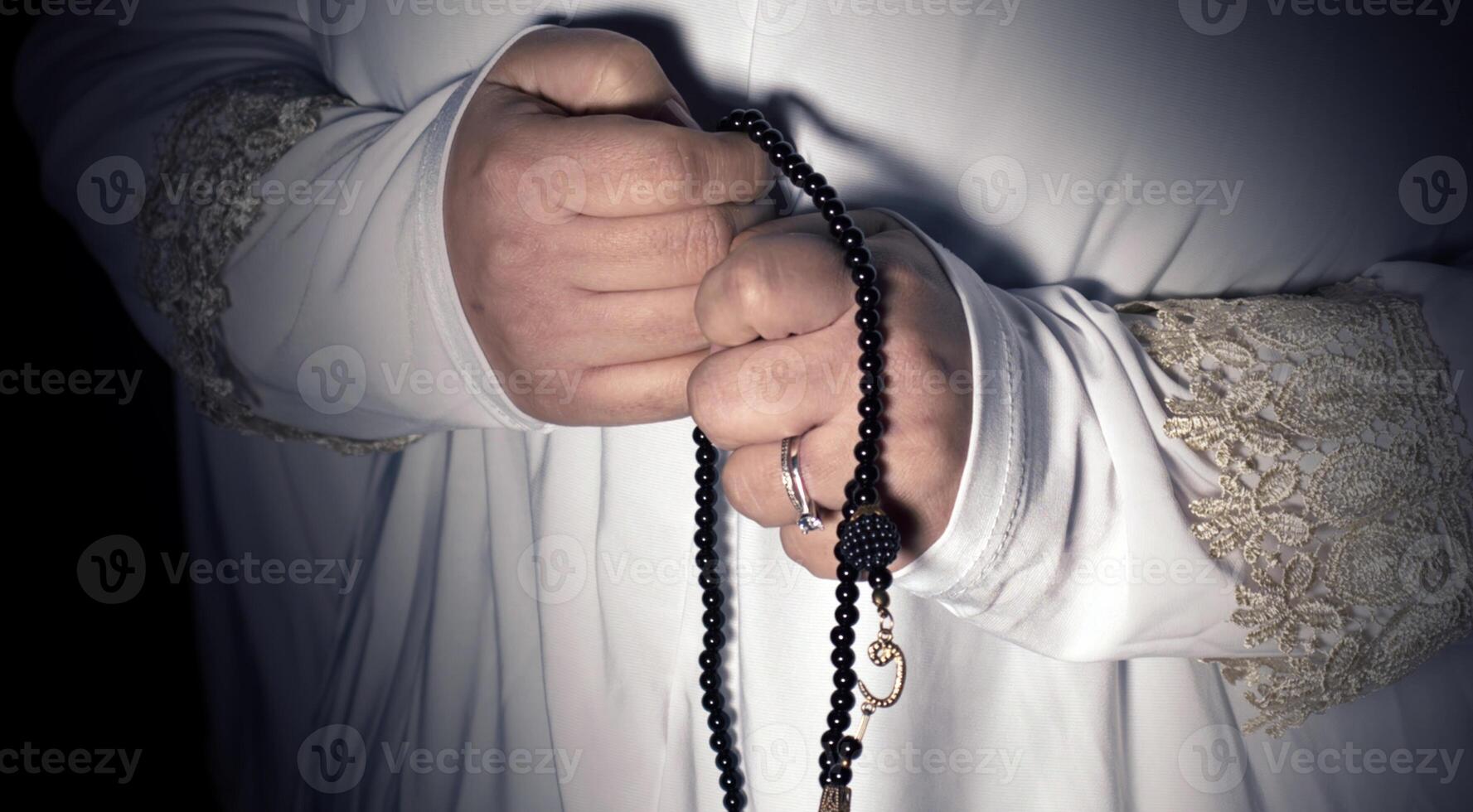 Religious muslim woman in prayer outfit photo