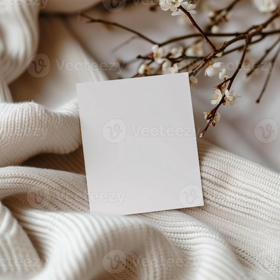 AI generated blank note paper on white cardigan with dry small white flower mockup template photo