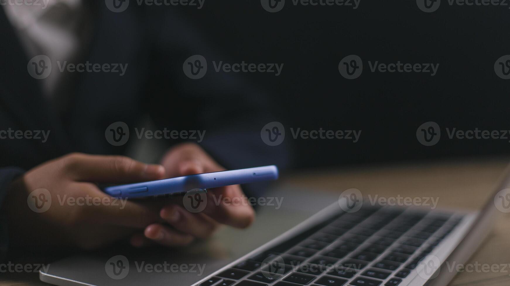 Businessmen use smartphones in offices with copy space for putting text, icons, and logo concepts for banners, wallpaper, backgrounds, and ideas. selective focus on smartphones. photo