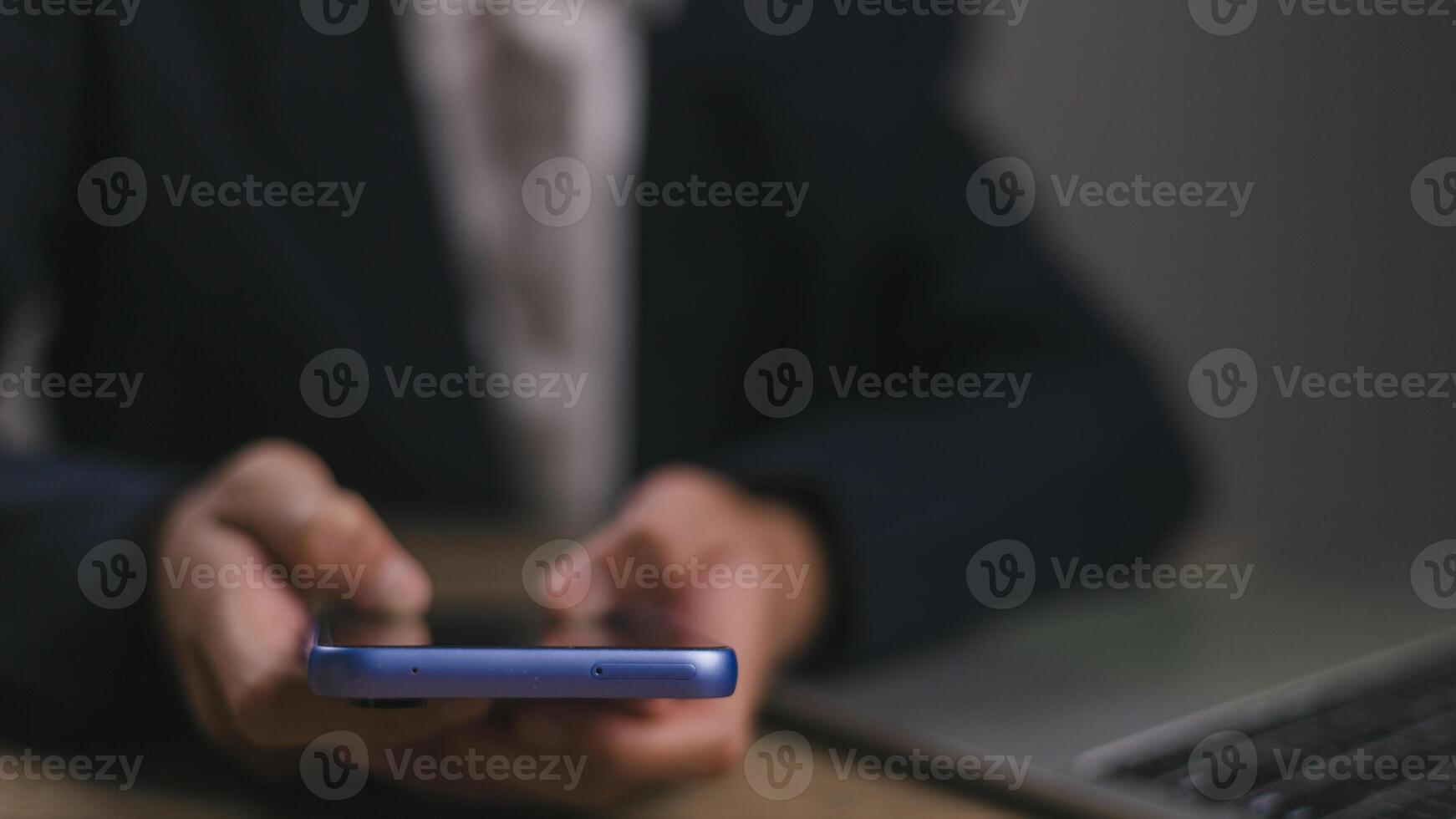 Businessmen use smartphones in offices with copy space for putting text, icons, and logo concepts for banners, wallpaper, backgrounds, and ideas. selective focus on smartphones. photo