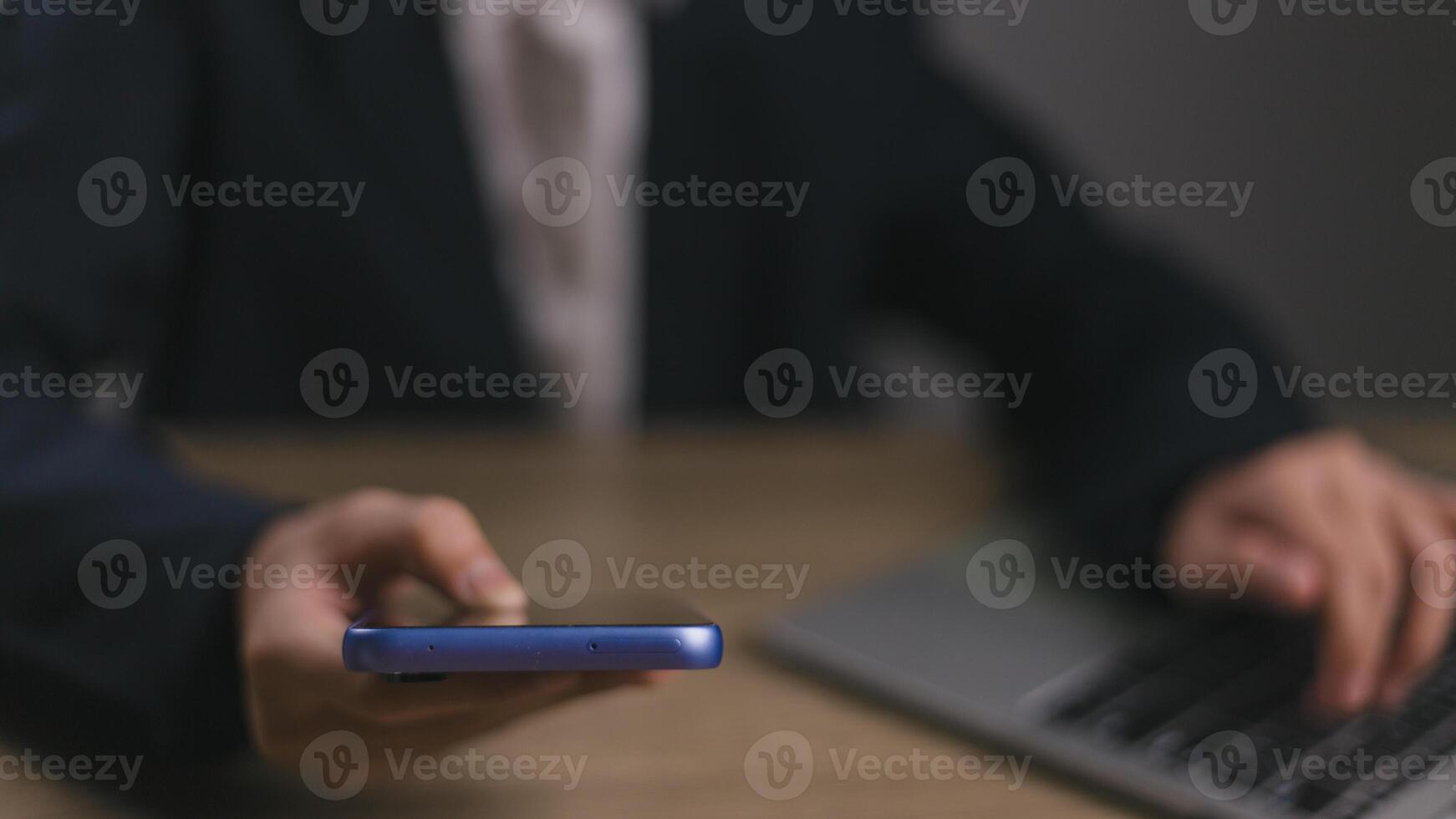 Businessmen use smartphones in offices with copy space for putting text, icons, and logo concepts for banners, wallpaper, backgrounds, and ideas. selective focus on smartphones. photo