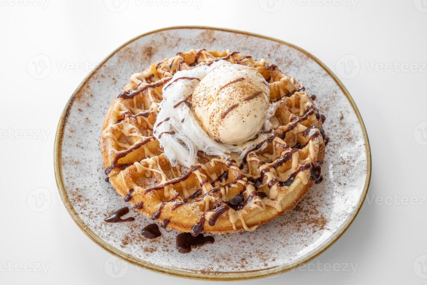 Churros Waffle with chocolate served in a dish isolated on grey background top view photo