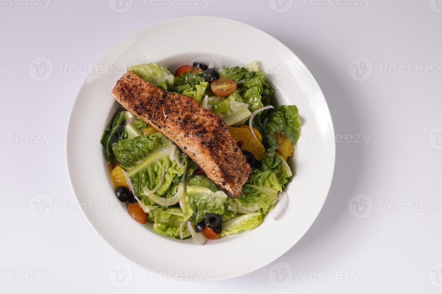Healthy BLACKENED SALMON SALAD in a dish top view on grey background singapore food photo
