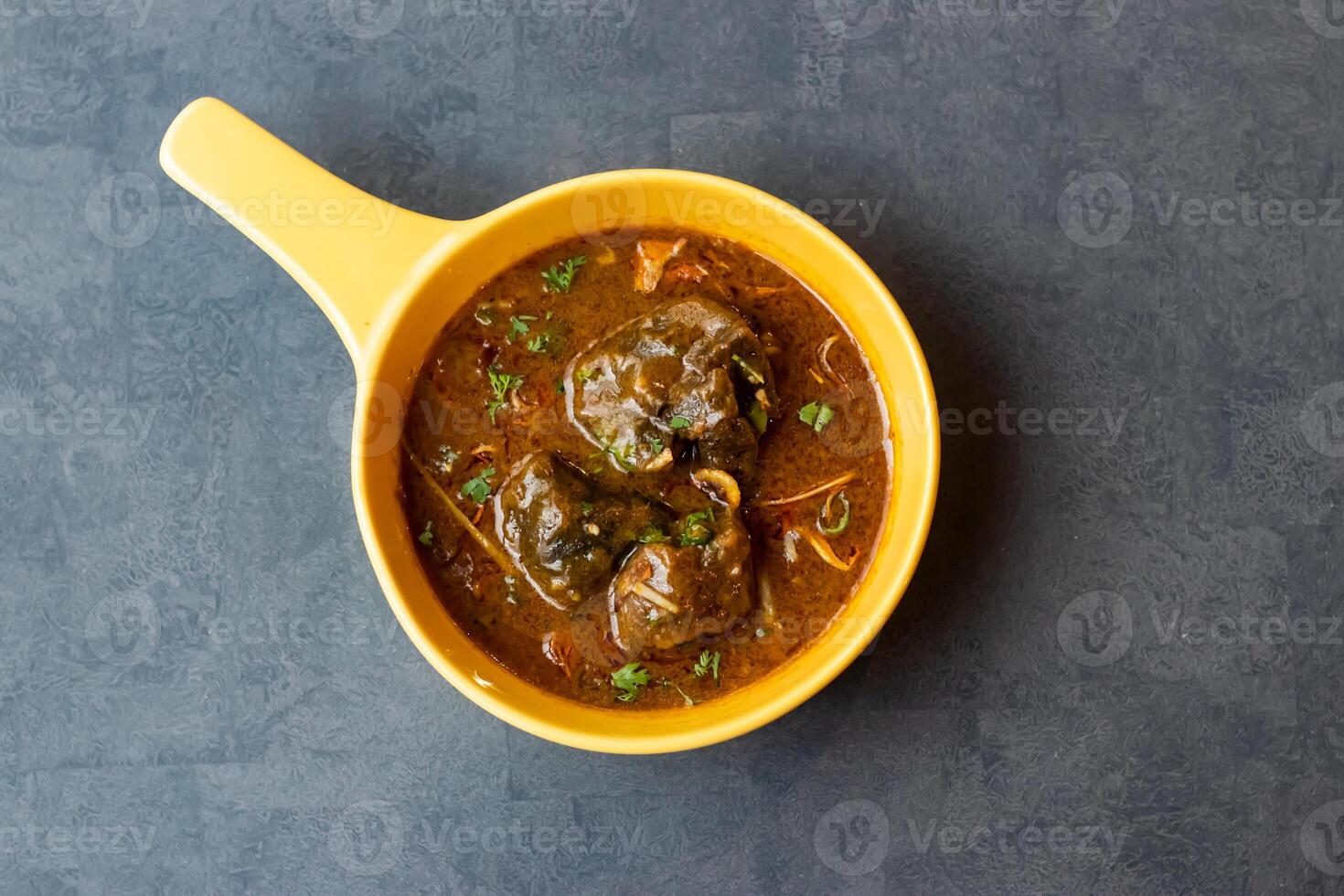 Beef Nehari korma karahi served in dish isolated on table top view of asian and indian food photo