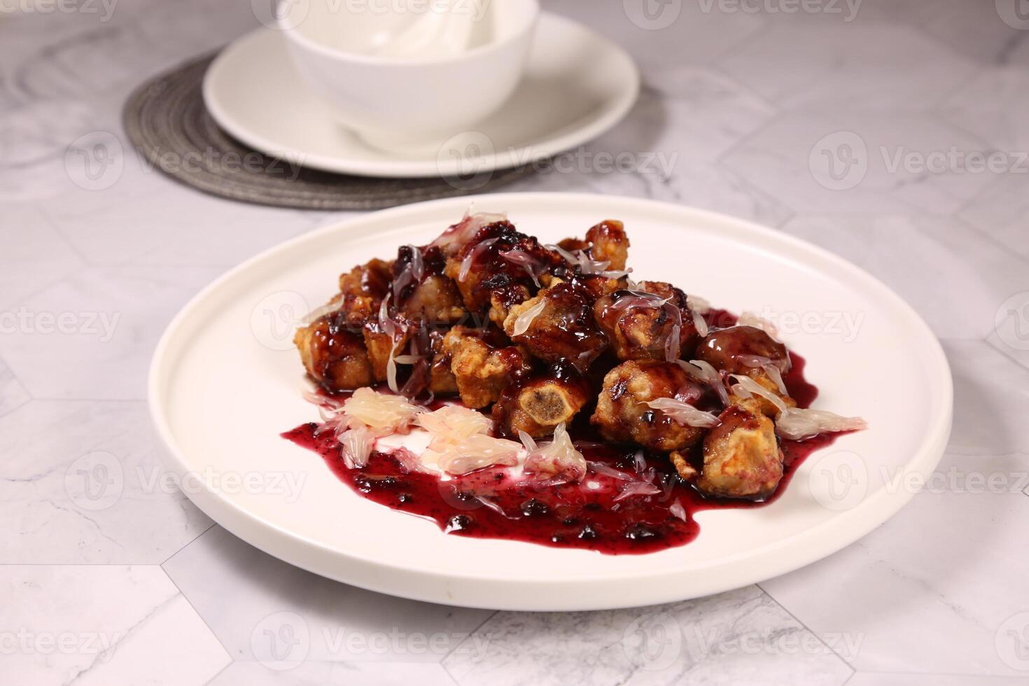 Yuzu Blueberry Bone in a dish isolated on grey background side view of Hong kong food photo