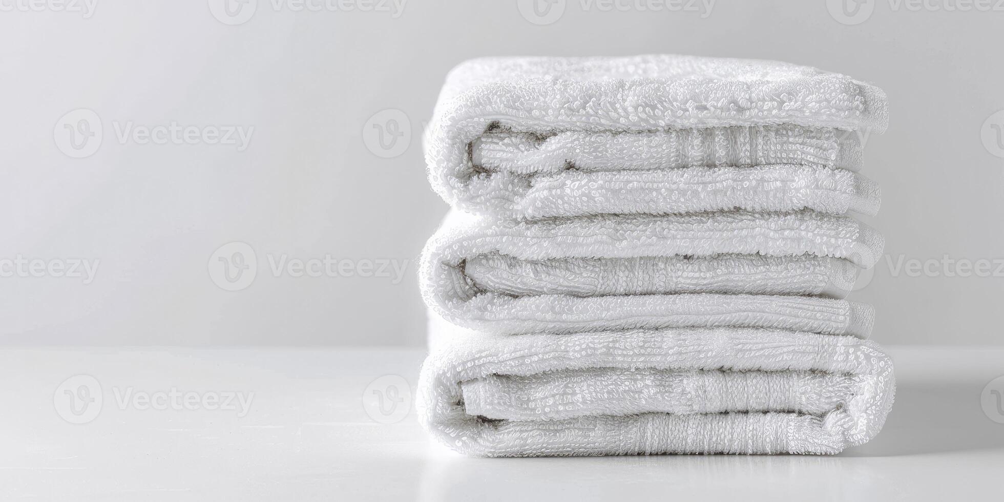 AI generated Simple Stack of Crisp, Folded White Towels Against a Pure White Background. photo