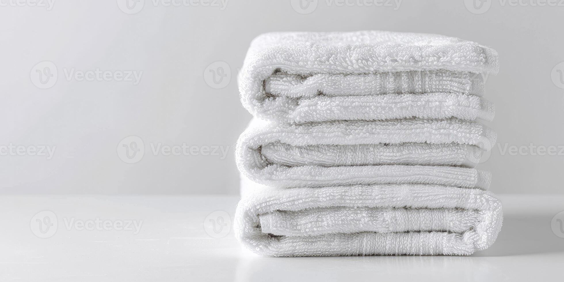 AI generated Simple Stack of Crisp, Folded White Towels Against a Pure White Background. photo