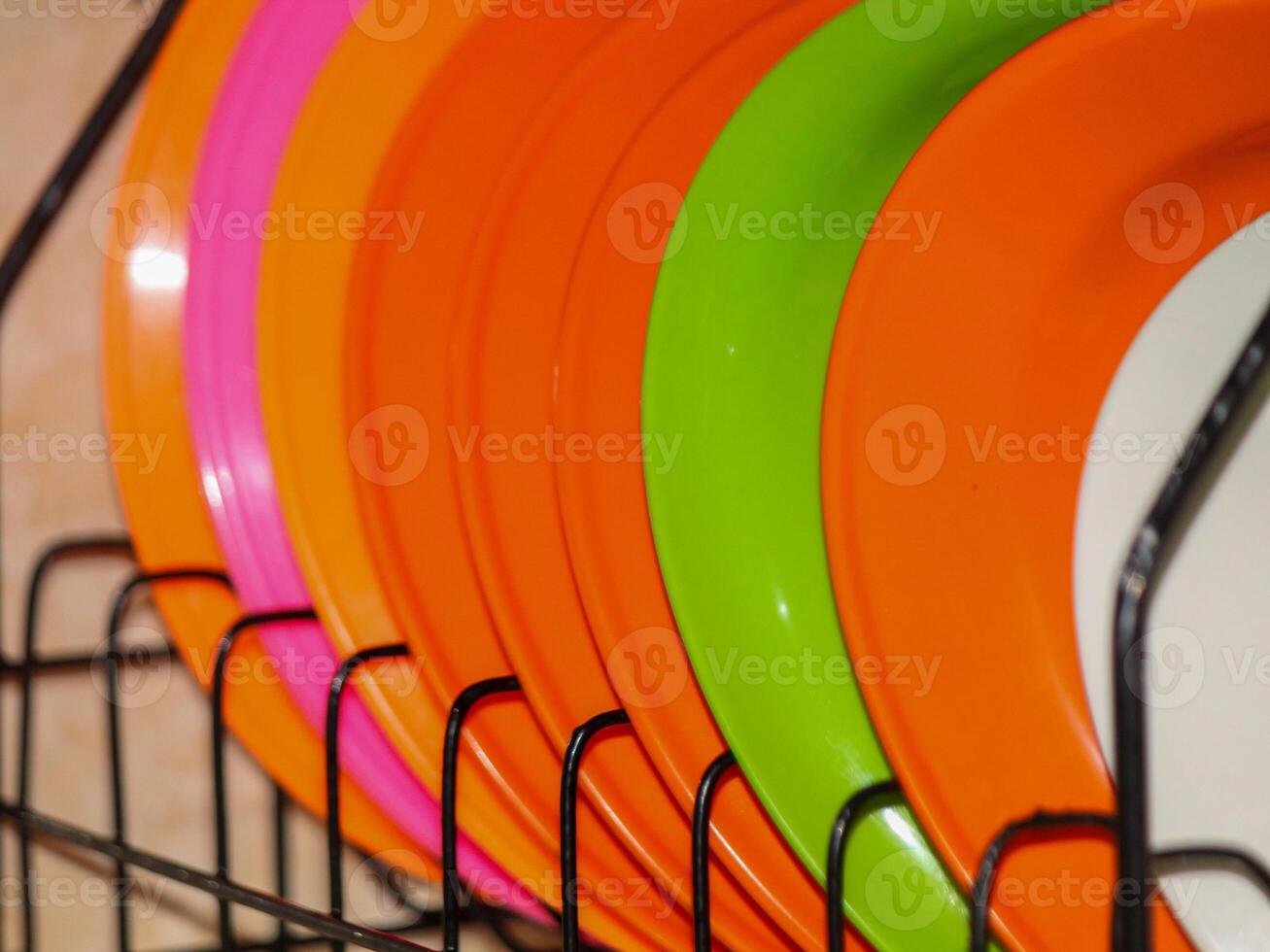 Plates are stacked on shelves photo
