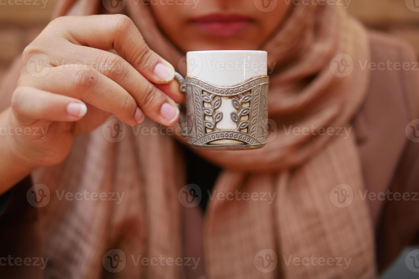 women drinking turkish coffee at cafe photo