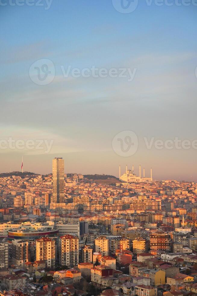 Arial View of Istanbul city buildings and camlica mosque in background photo