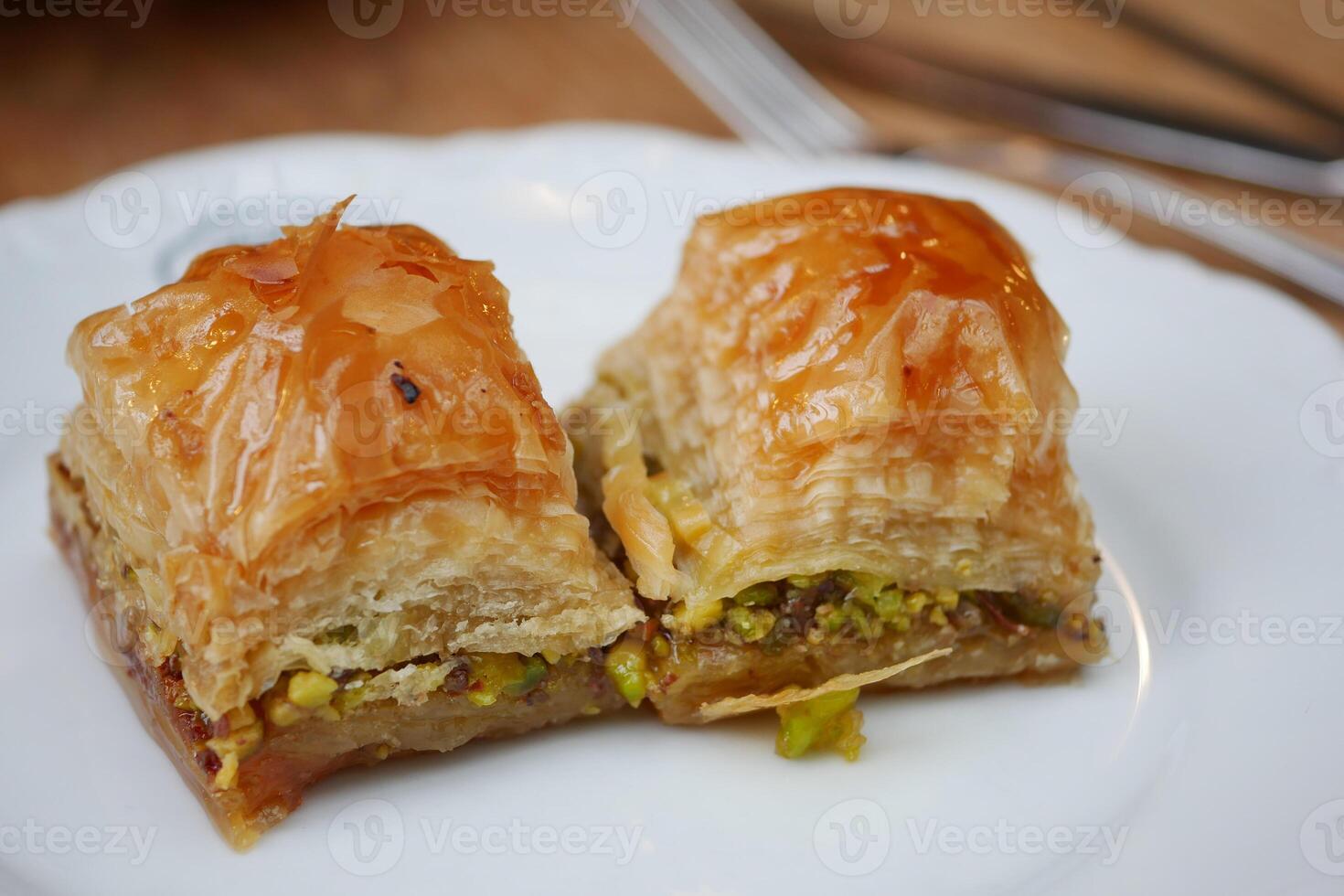 handmade turkish dessert baklava on table photo