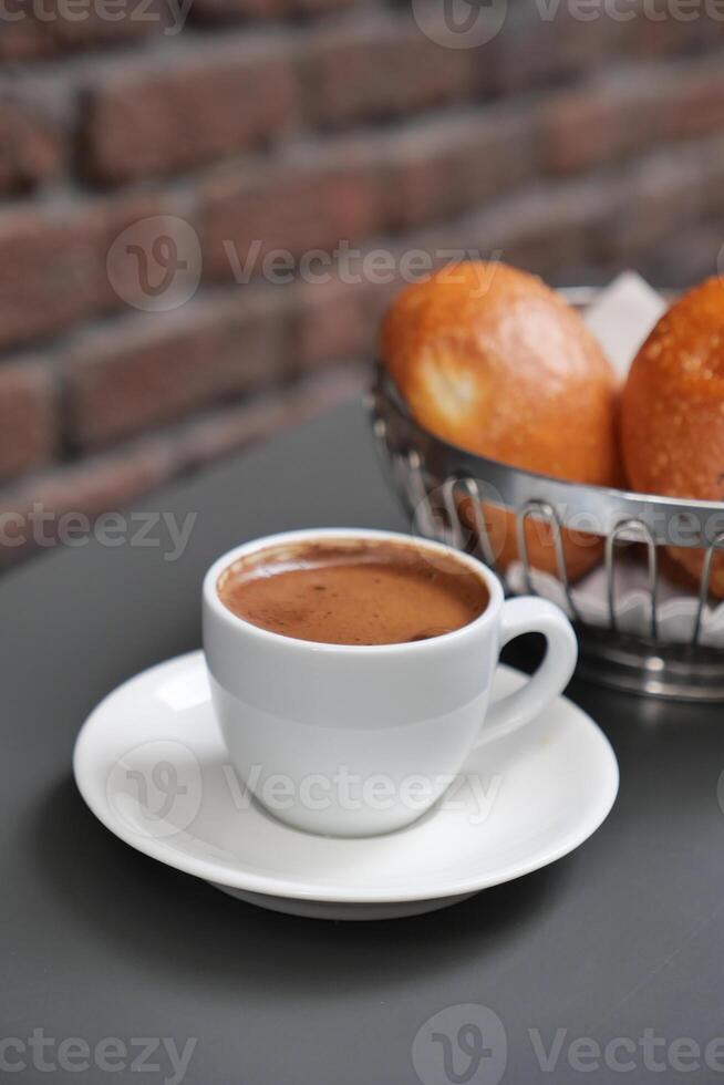 a cup of turkish coffee on table photo