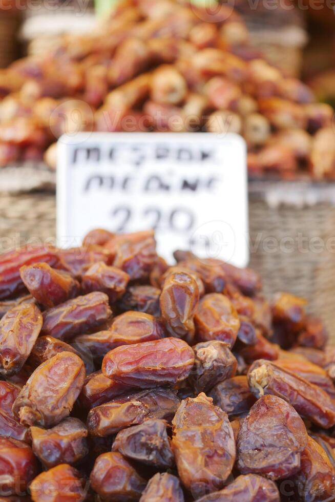 many date fruits display for sale at local market photo