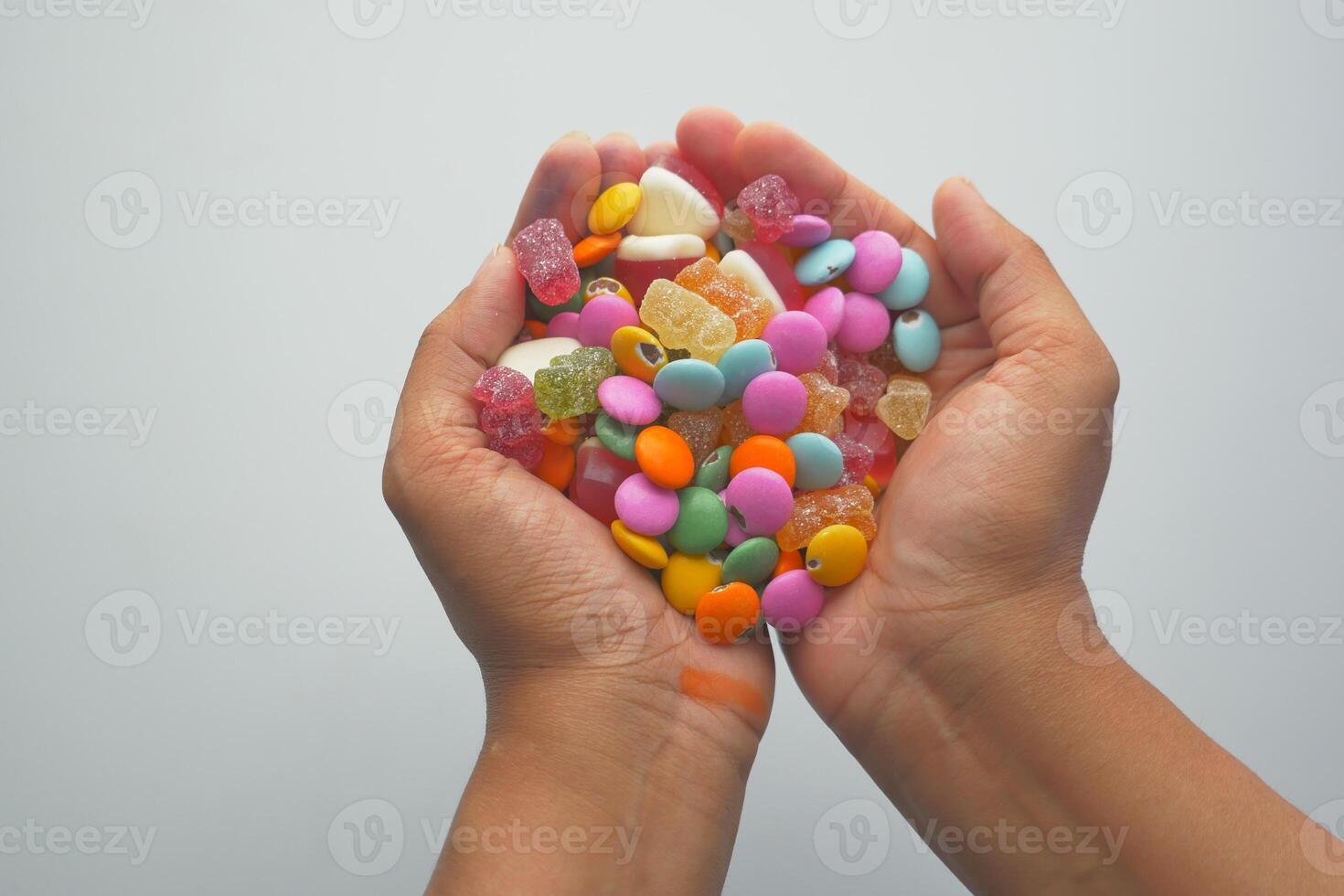 colorful candy sweet jelly on hand photo