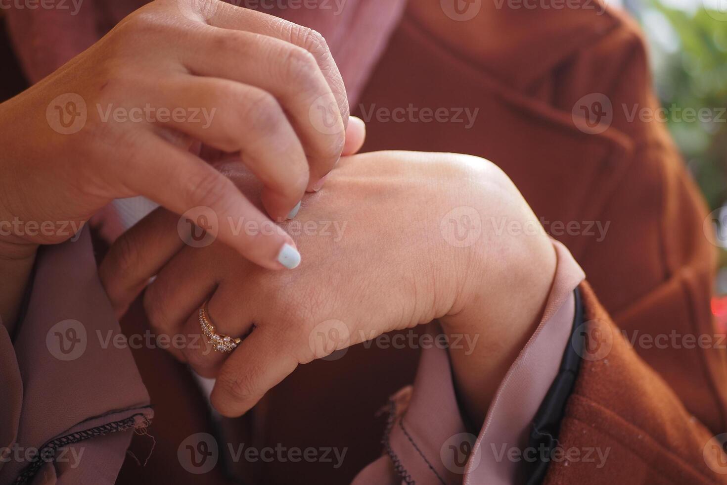 women suffering from itching skin, close up. photo