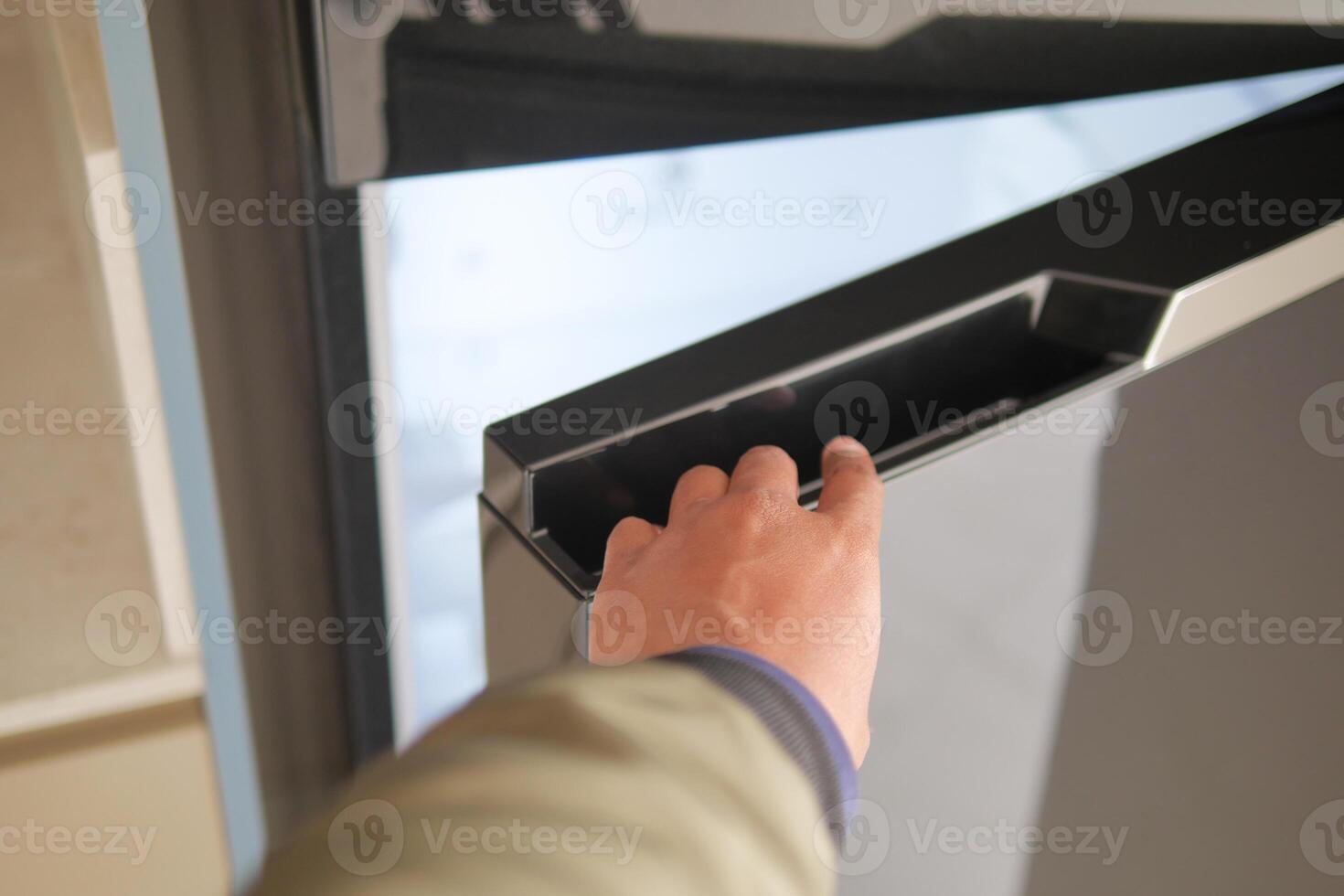 pov shot of hand open fridge door photo