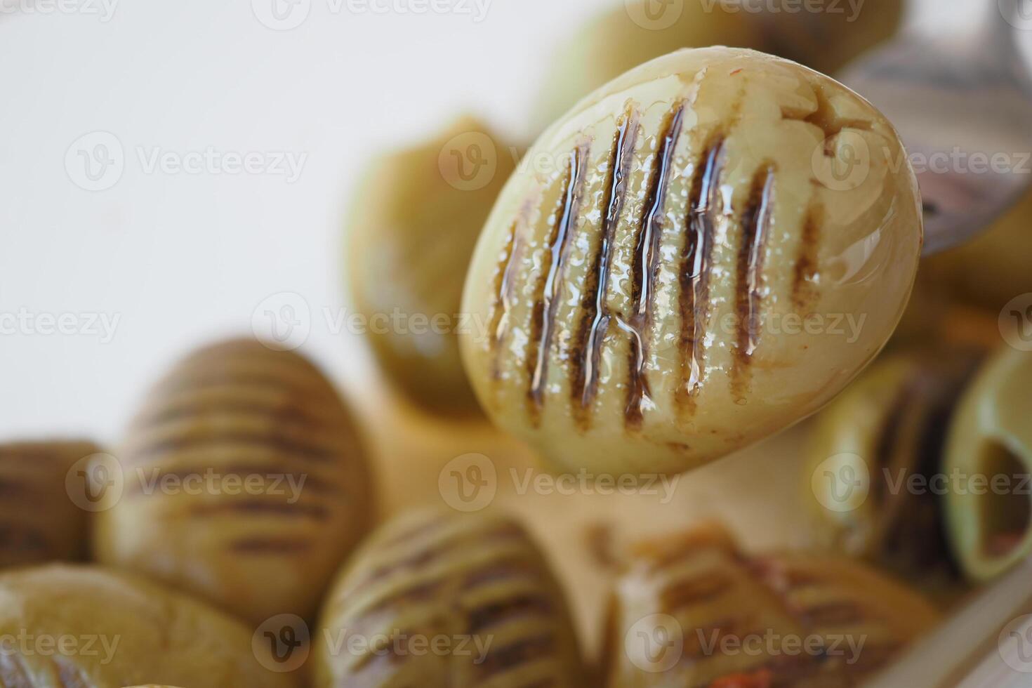 Turkish Grilled olives in a bowl photo