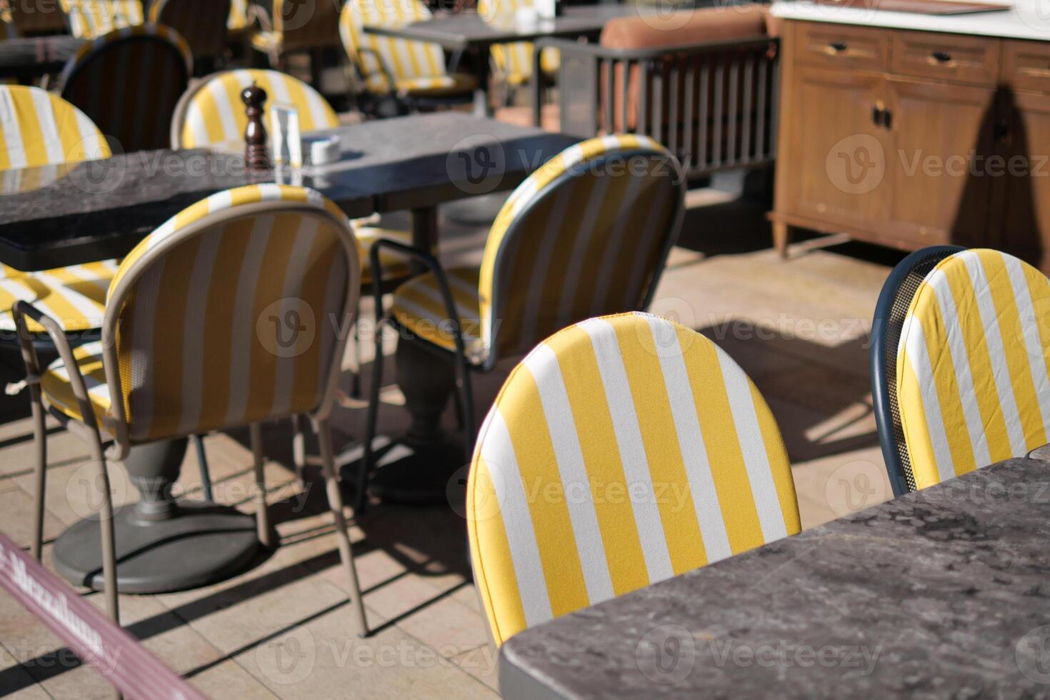 Outdoor restaurant tables with yellow chairs istanbul photo