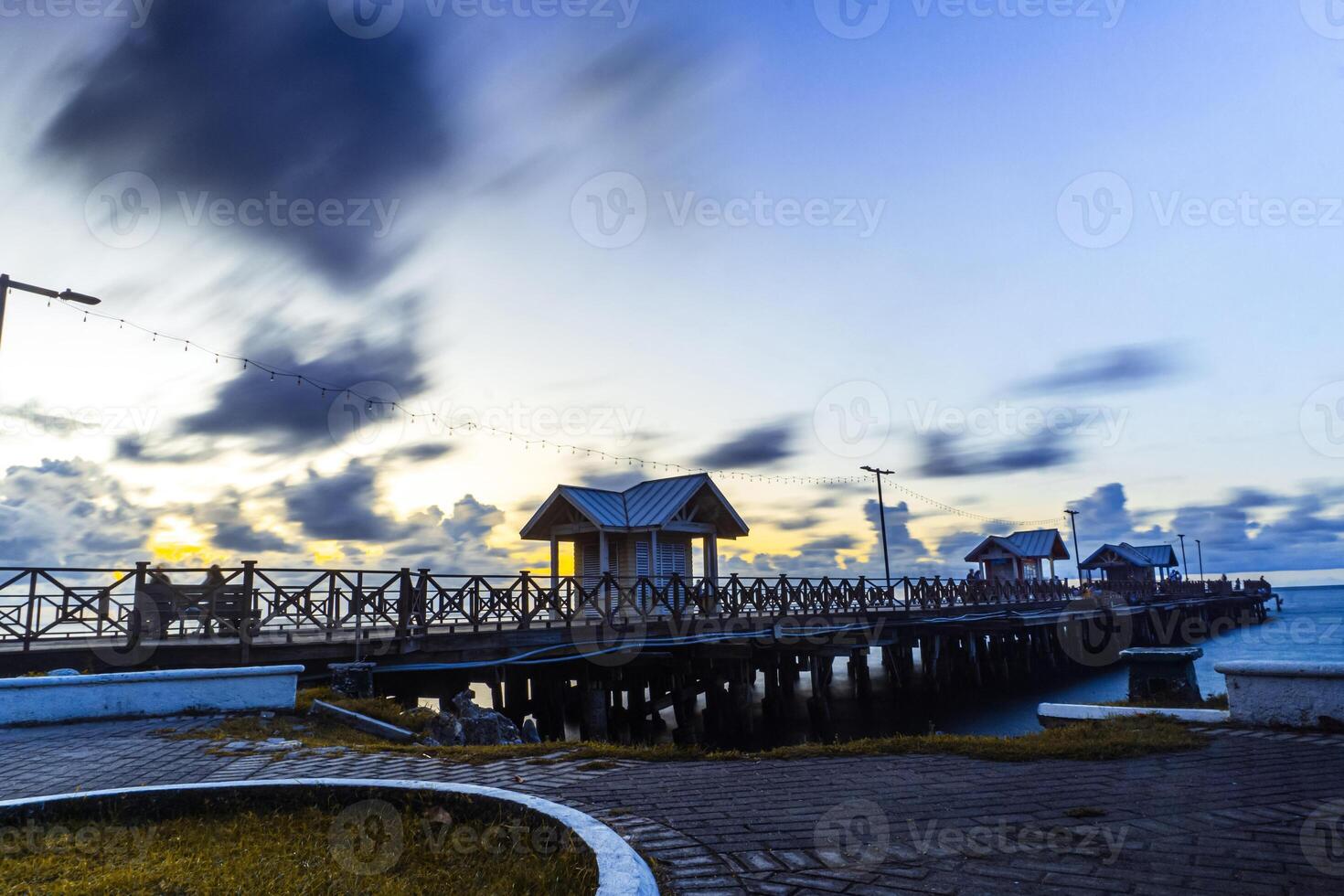Sunset in front of the tourist pier in the city of La Ceiba, Honduras. photo