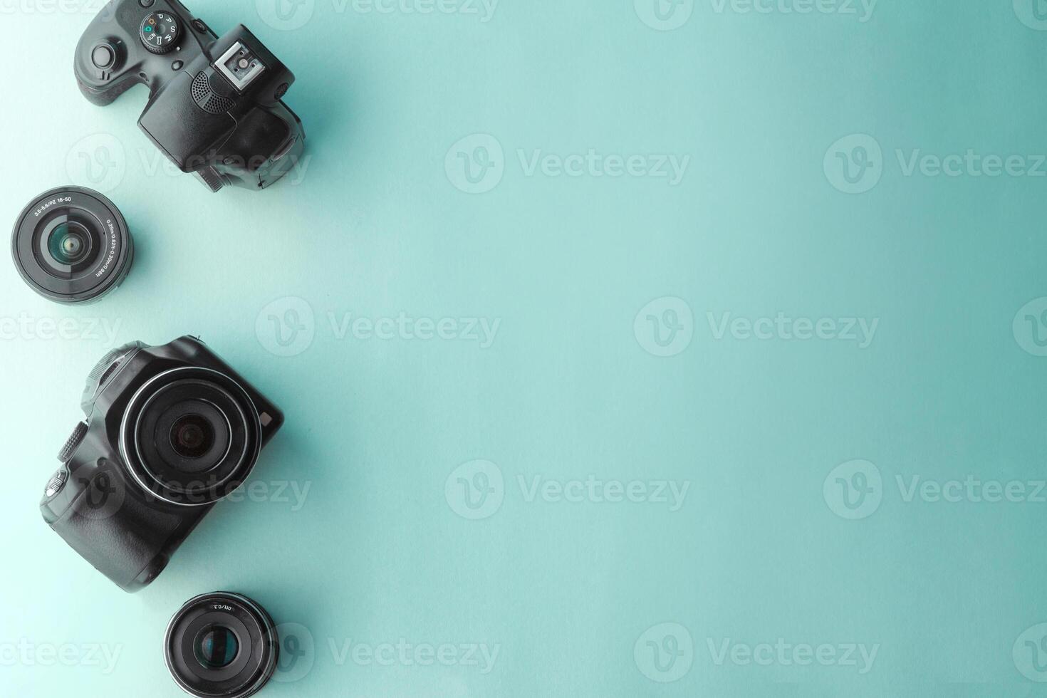 camera and lens over background photography concept. photo
