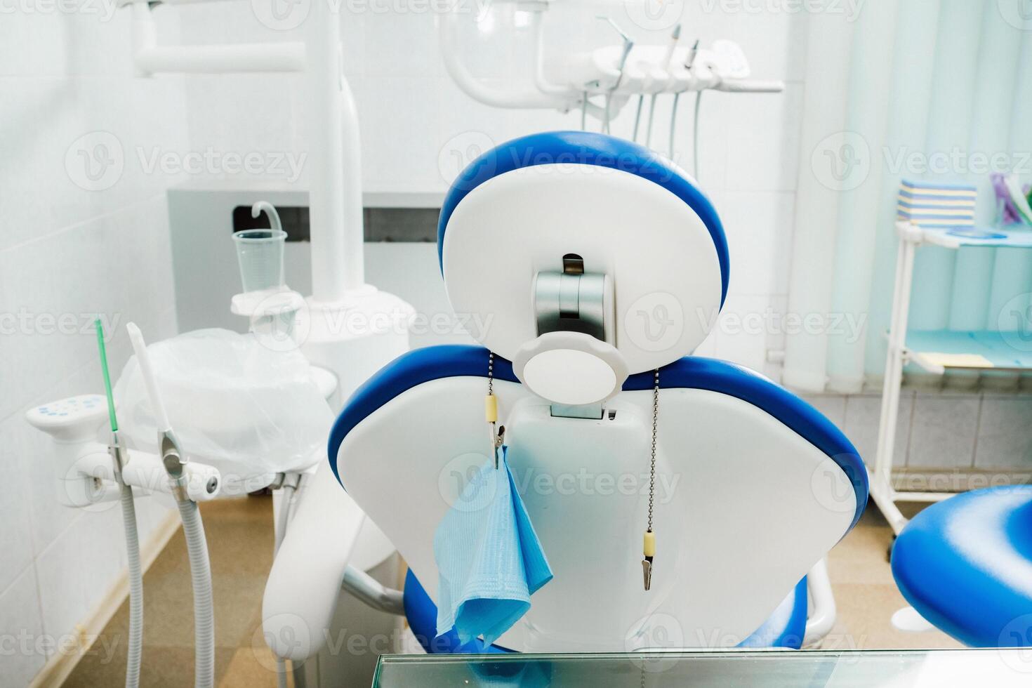An empty chair in the dentist's office. Empty dentist's office photo