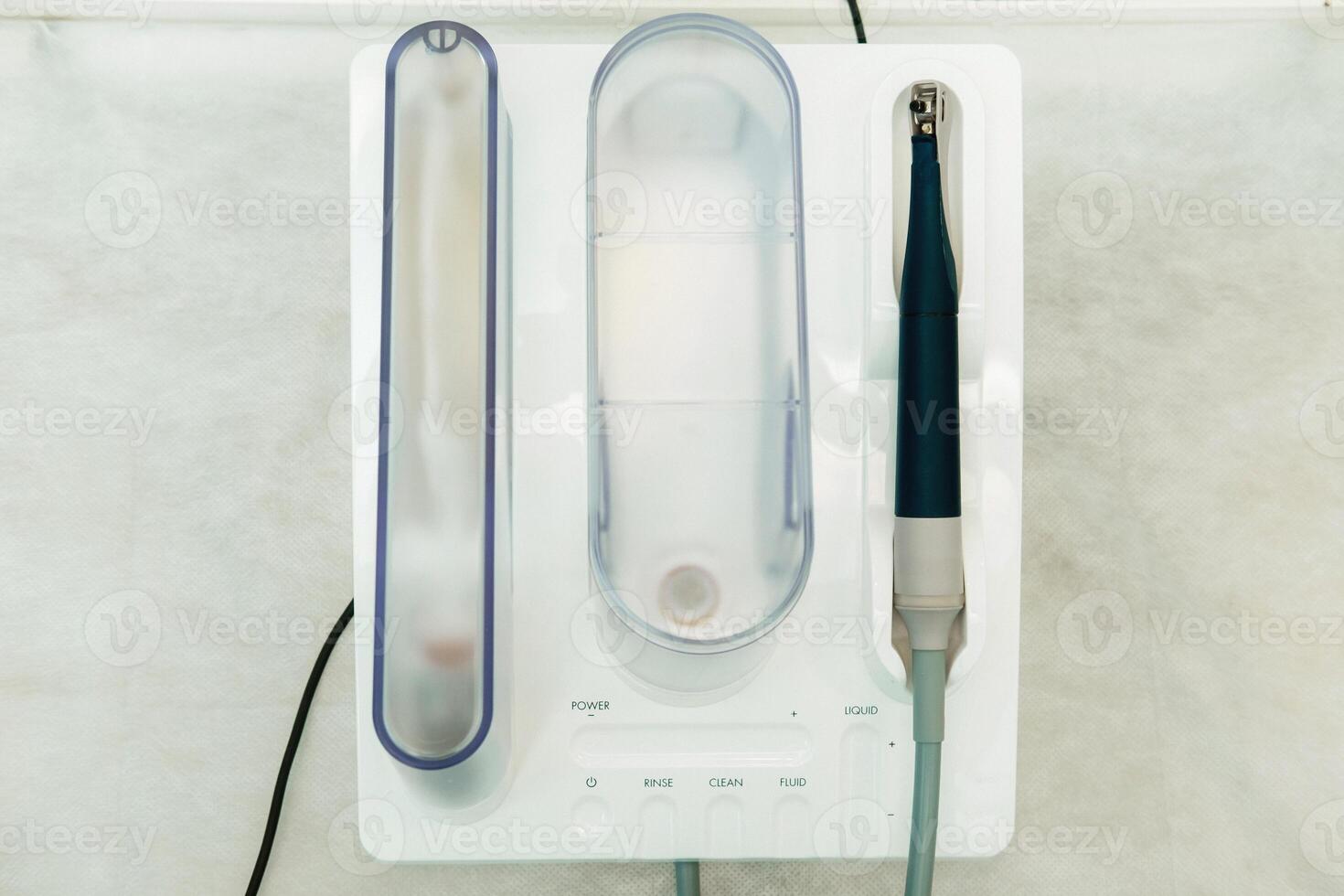 Ultrasonic scaler in the dental office. Dentistry Concept photo