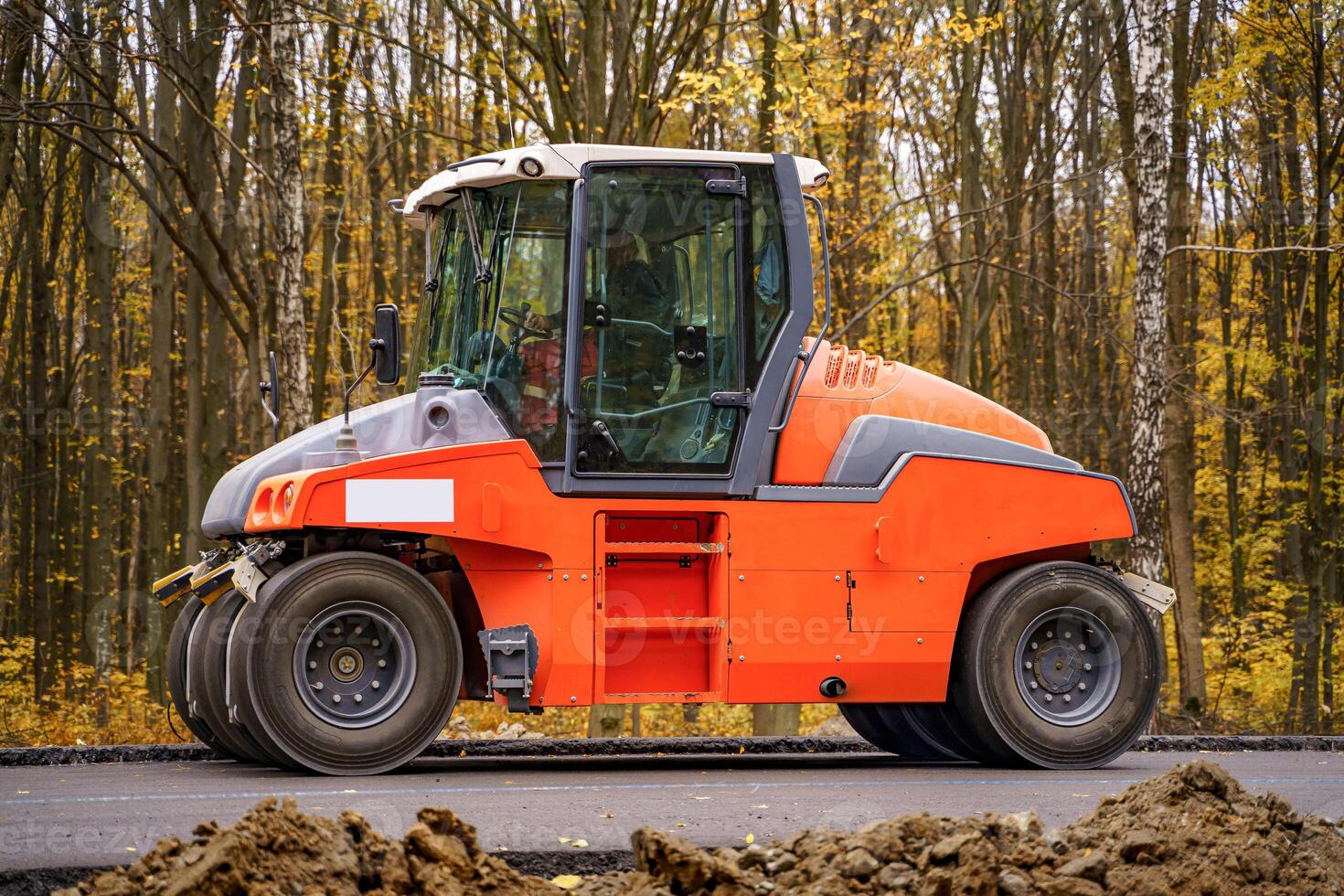 Heavy vibration roller at asphalt pavement works. Road repairing. photo