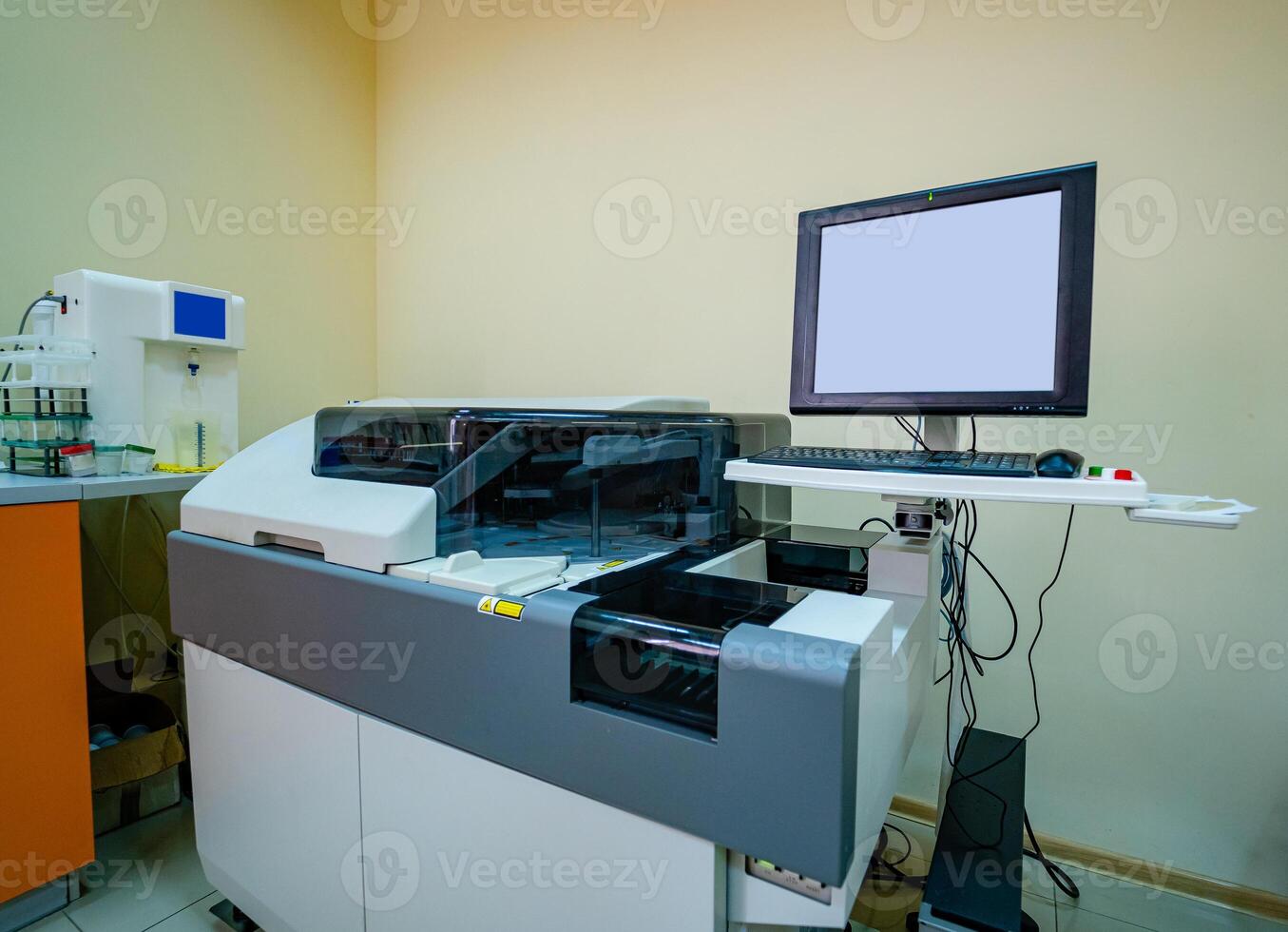 Modern robotical machine for centrifuge blood and urine testing. Monitor for results. Closeup. photo