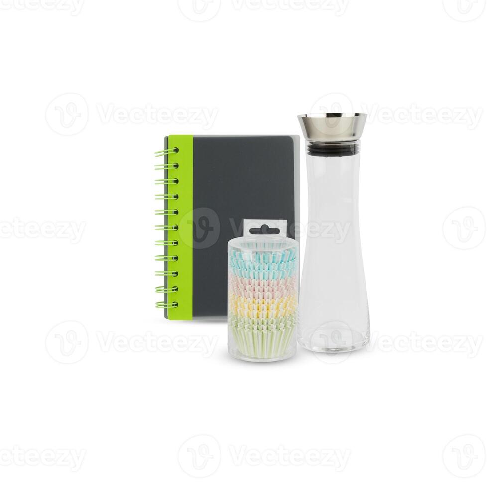 Glass bottle, plastic box, notebook cut out isolated white background with clipping path photo