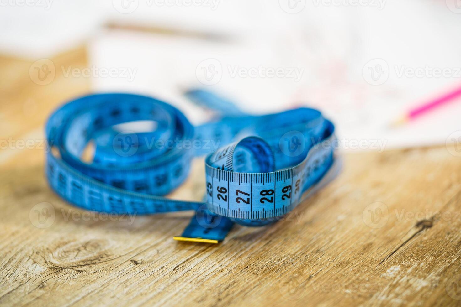 Curved measuring tape. Tailor s of the tailor close-up. photo