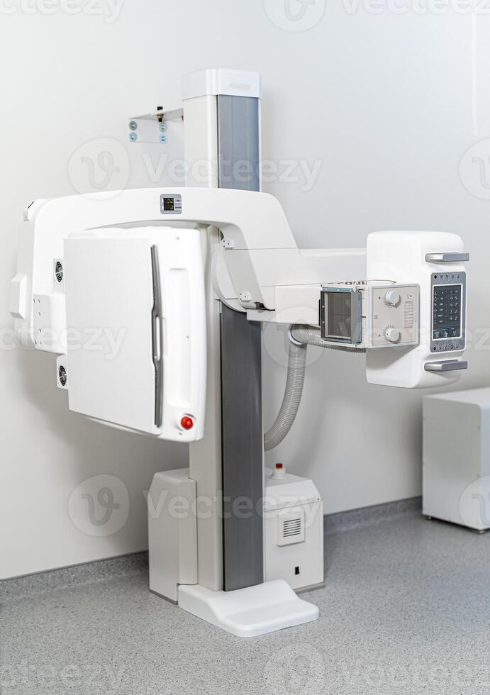 Equipment for roentgen in modern clinic. Remote controlled X-ray machine in modern clinic. Focus on part of roentgen apparatus photo
