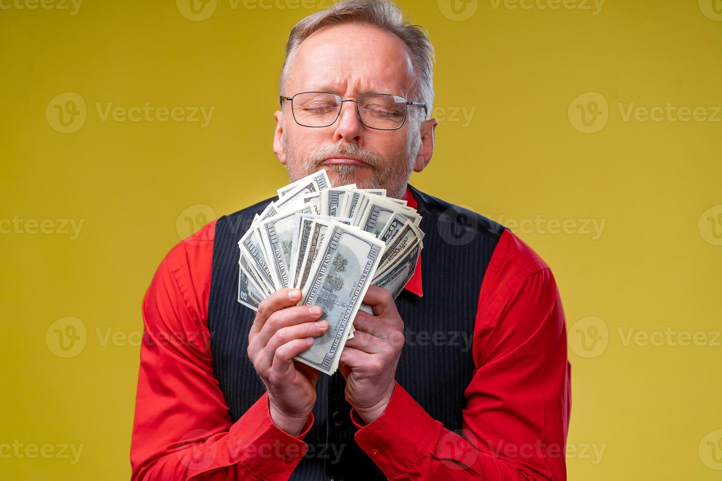 Portrait of very excited man with bunch of money. Lucky day. Human emotions and facial expressions photo