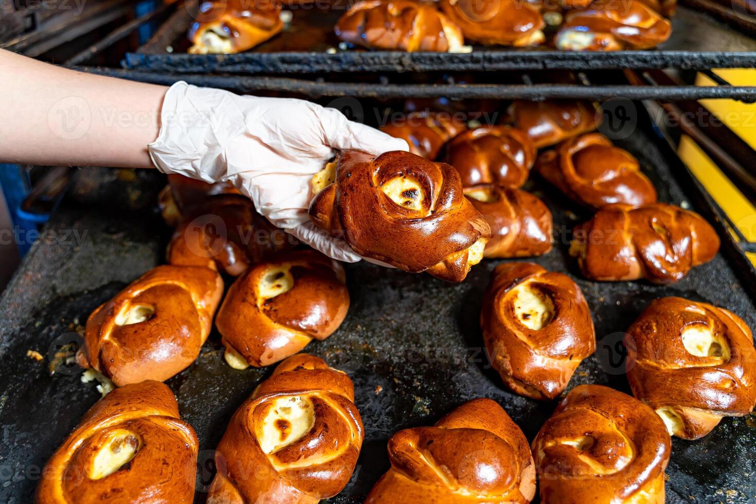 Buns production line. Professional oven at factory. Industrial food production. photo