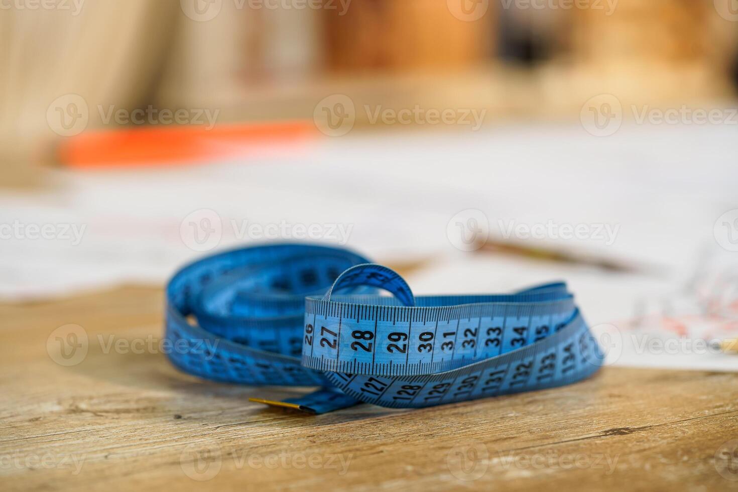 Measuring tape. Selective focus with blurred background. Tailor s work. Tailor concept. Close-up. photo