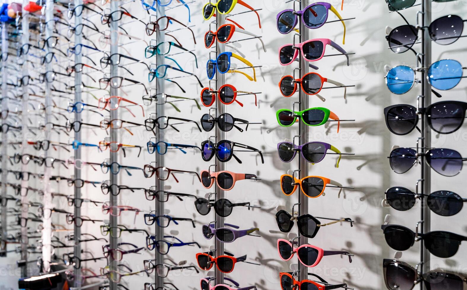 Eyeglasses show products on the shelf. Glasses multiple design. photo