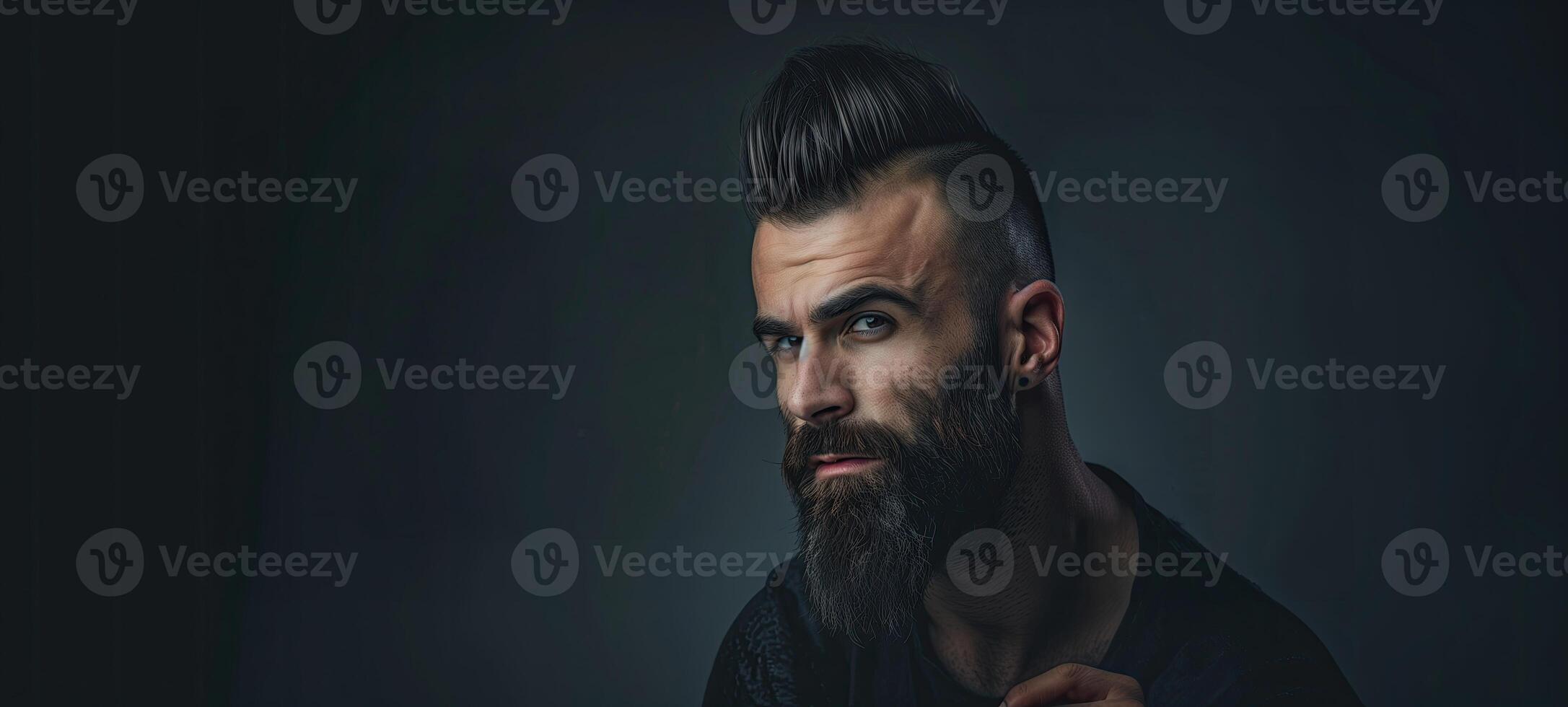 AI generated Portrait of a brutal handsome young man with a beard on a black background photo