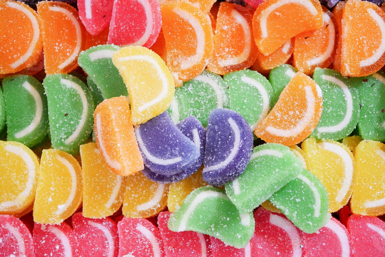 sugar coated jelly beans in the form of colored sliced fruit photo