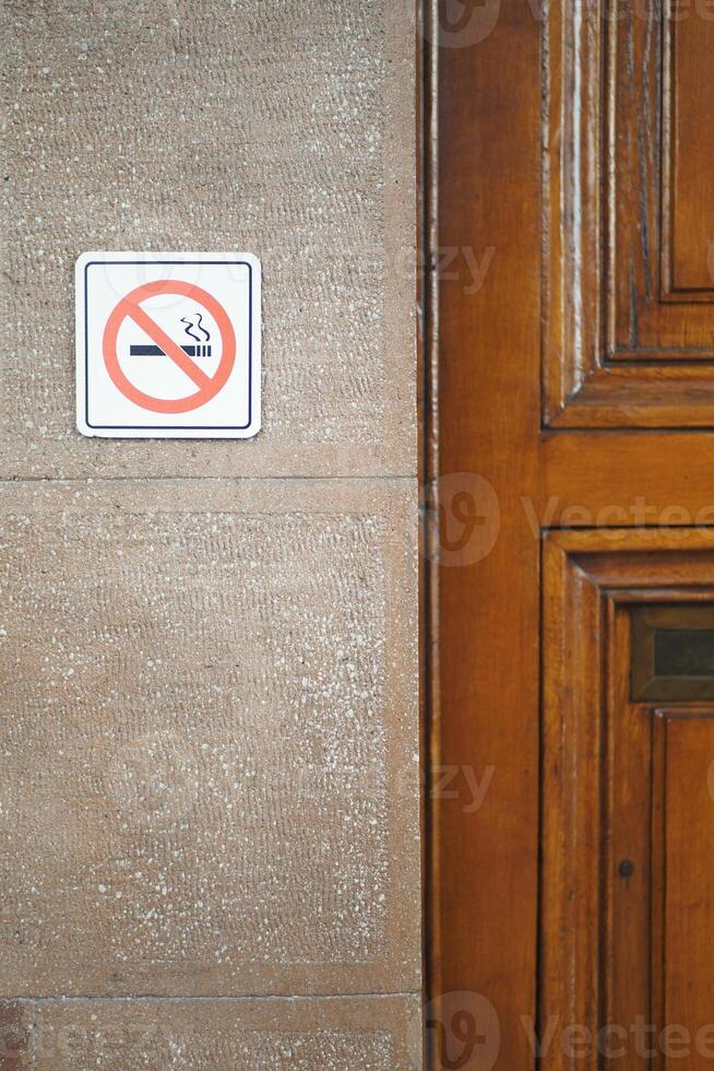 No smoke sign on a wall photo