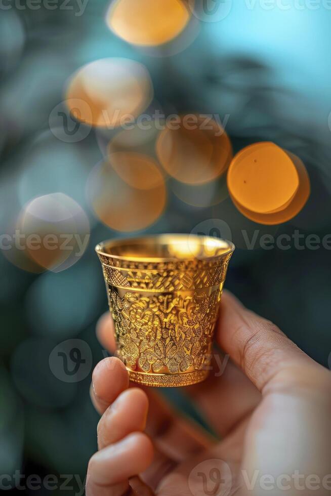 AI generated Close-up Person Holding a Small Arabian Coffee Cup, Immersed in the Rich Aroma of Tradition photo