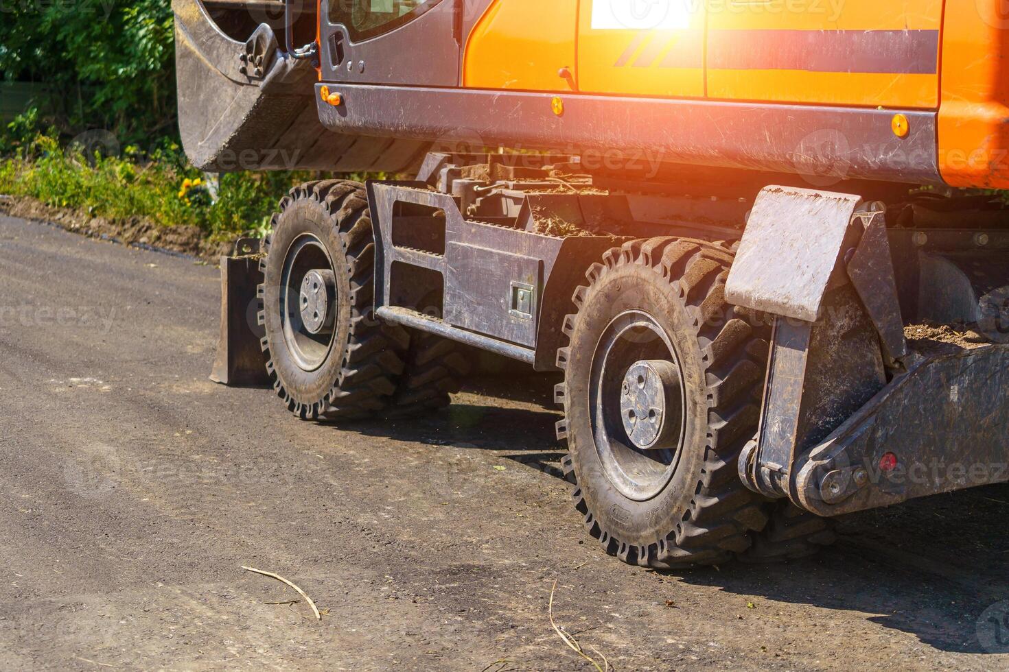 Heavy duty road building. Road repairing. Selective focus on heavy machinery. photo