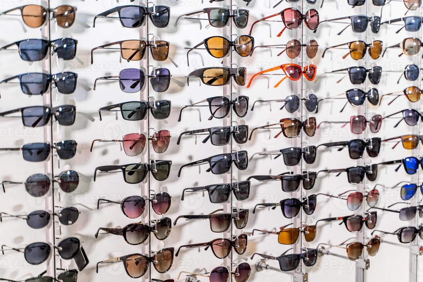 Sales rack of sunglasses. A colorful display of sunglasses for sale. Closeup. photo