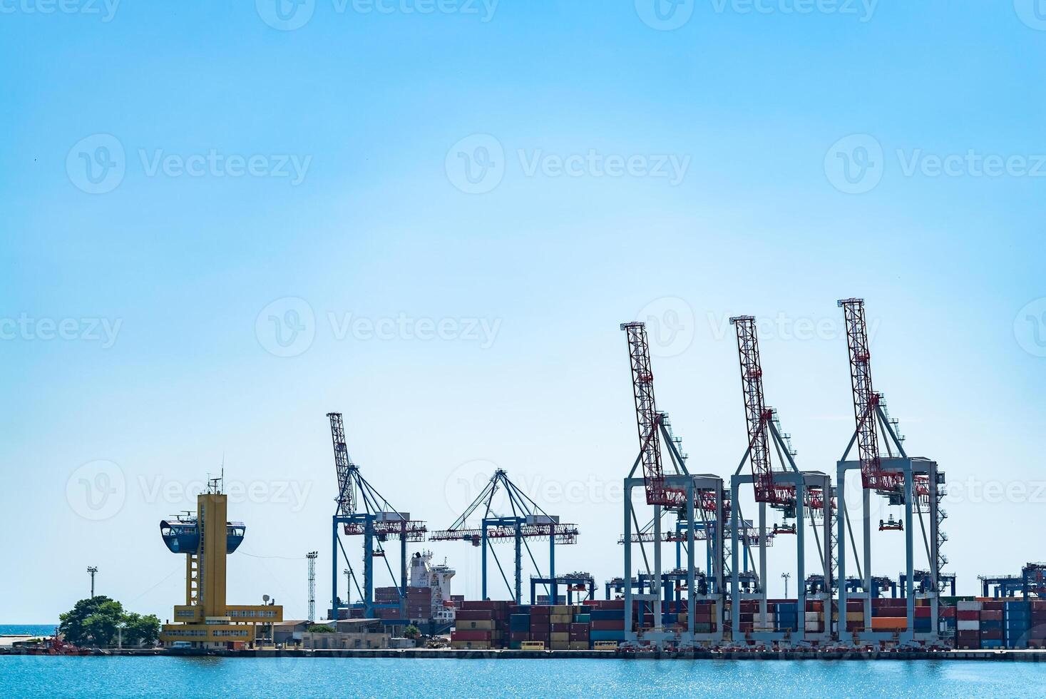 Logistics business. Huge cranes and containers, sunny summer day. International port photo