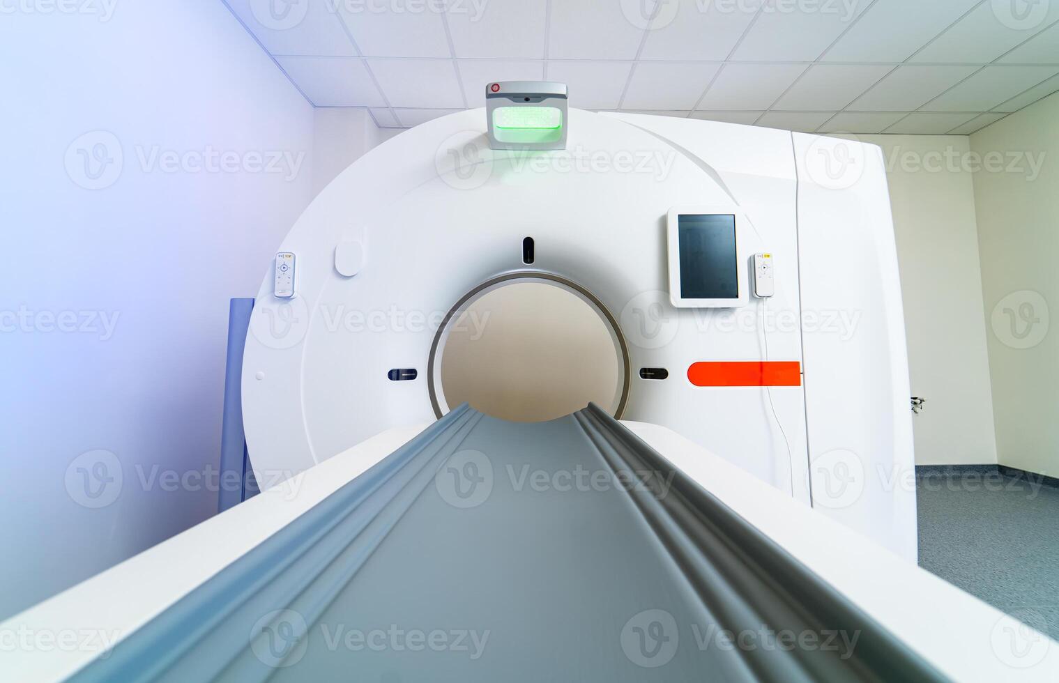 Examination table of a MRI scanner. Newest CT, MRI scanner in a modern hospital room. Clinic with up-to-date equipment. photo