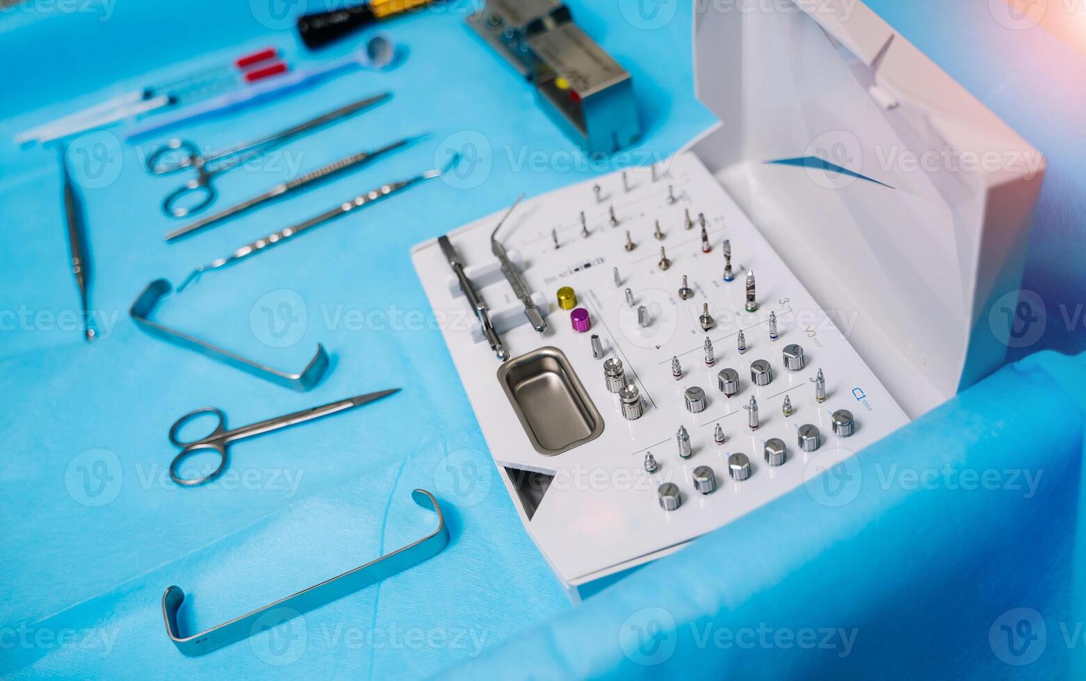 Set of dentist tools on table. Dentist mirror, forceps curved, explorer curved, dental explorer angular and explorer curved with chip, right. Dental hygiene and health concept. photo