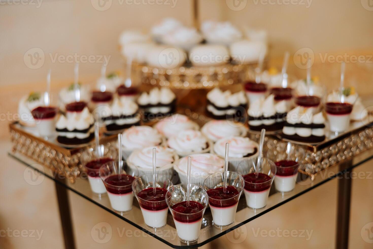 Almond cookies, sweet cakes for a wedding banquet. A delicious reception, a luxurious ceremony. Table with sweets and desserts. Delicious colorful French desserts on a plate or table. Candy bar. photo