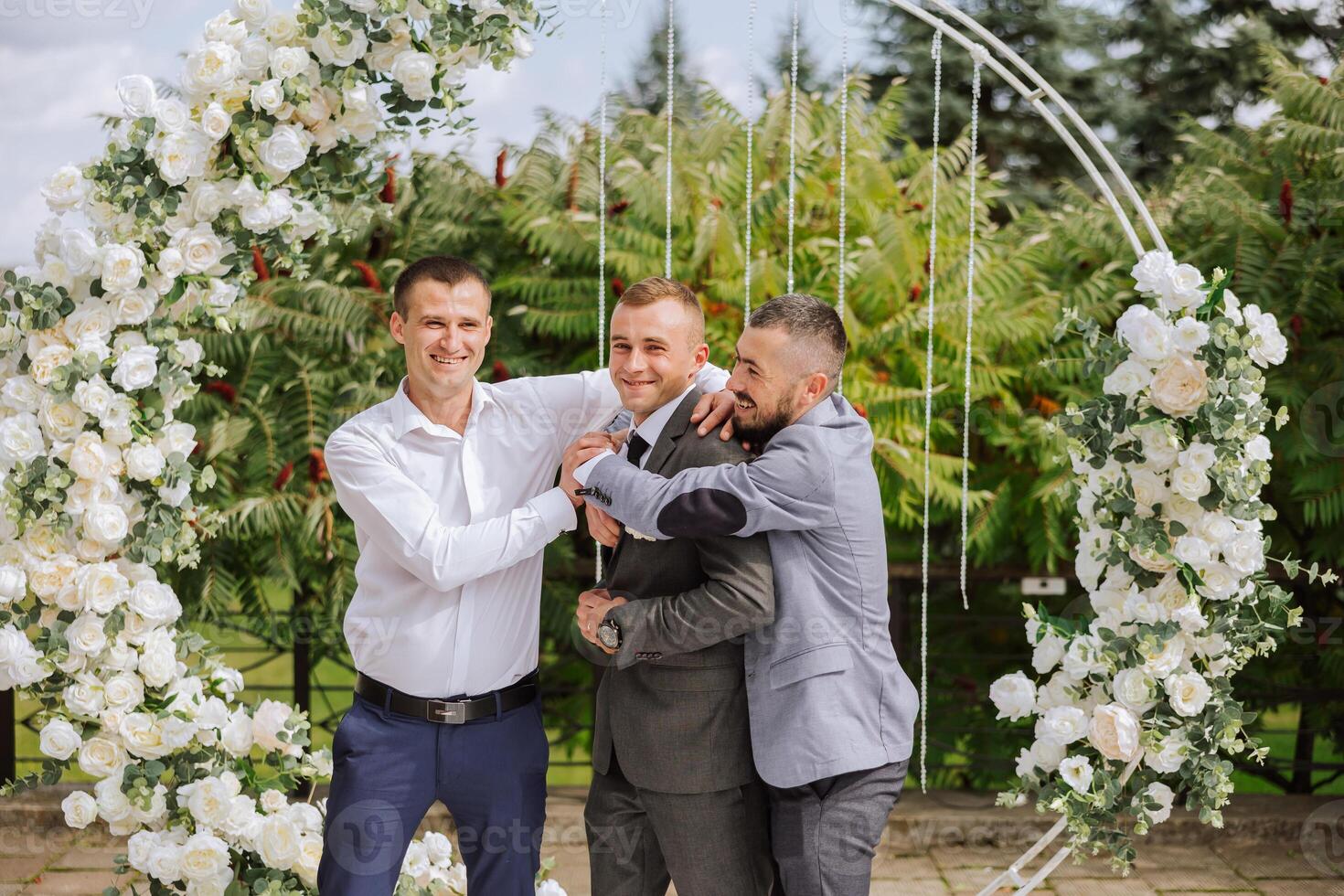 Wedding photography. The groom and his friends photo