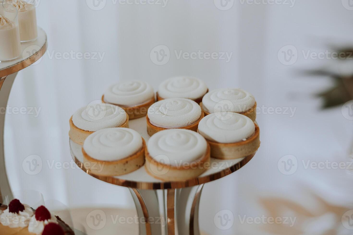 Almond cookies, sweet cakes for a wedding banquet. A delicious reception, a luxurious ceremony. Table with sweets and desserts. Delicious colorful French desserts on a plate or table. Candy bar. photo